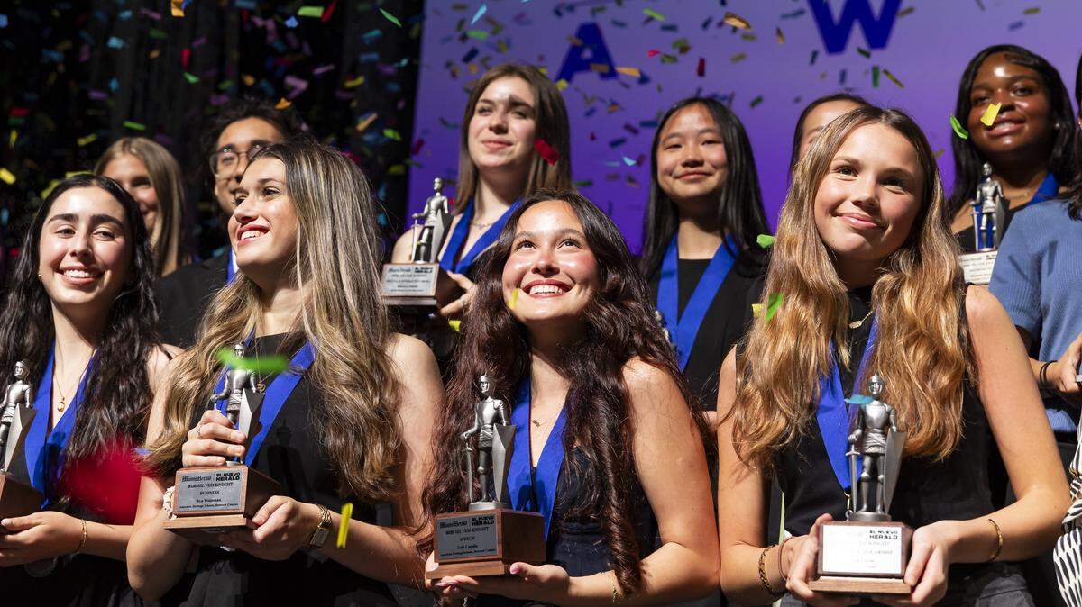 Silver Knight winner in Speech, Jade Capella, from American Heritage Schools, center, celebrates on stage with fellow recipients after receiving their awards during the Miami Herald & el Nuevo Herald 68th Silver Knight Award Ceremony at the James L. Knight Center on Tuesday, May 12, 2026, in downtown Miami, Fla.