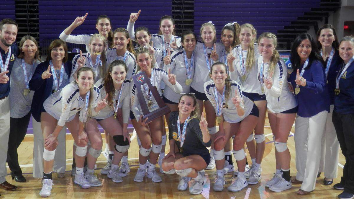 St. Thomas Aquinas players pose with their state championship trophy, their fourth in the past five years, following a 3-1 victory over Tampa Plant in the 8A state title game Thursday night at Suncoast Credit Union in Fort Myers.