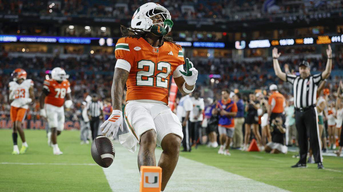 Miami Hurricanes running back Girard Pringle Jr. (22) scores in the second half of an NCAA football game against the Syracuse Orange at Hard Rock Stadium in Miami Gardens, Florida on Saturday, November 8, 2025.