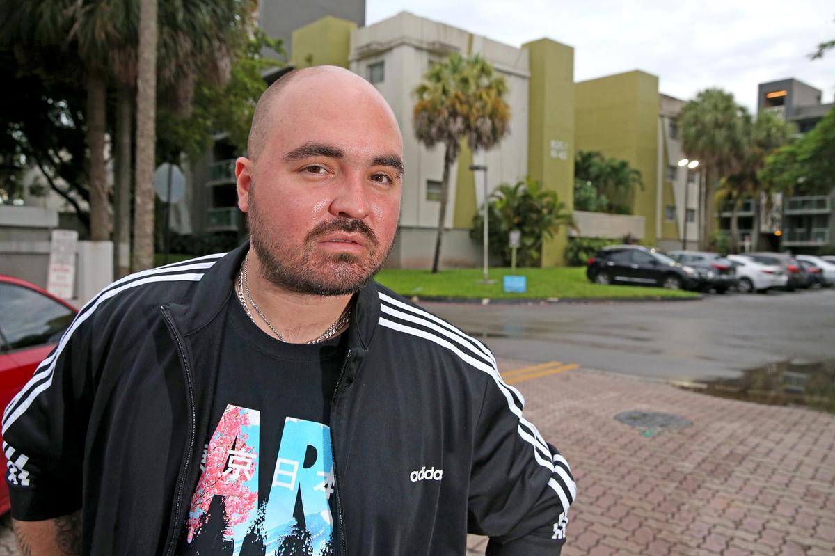 Carlos Lomena outside the Axis at One Pine apartments in Plantation, from which he was evicted.