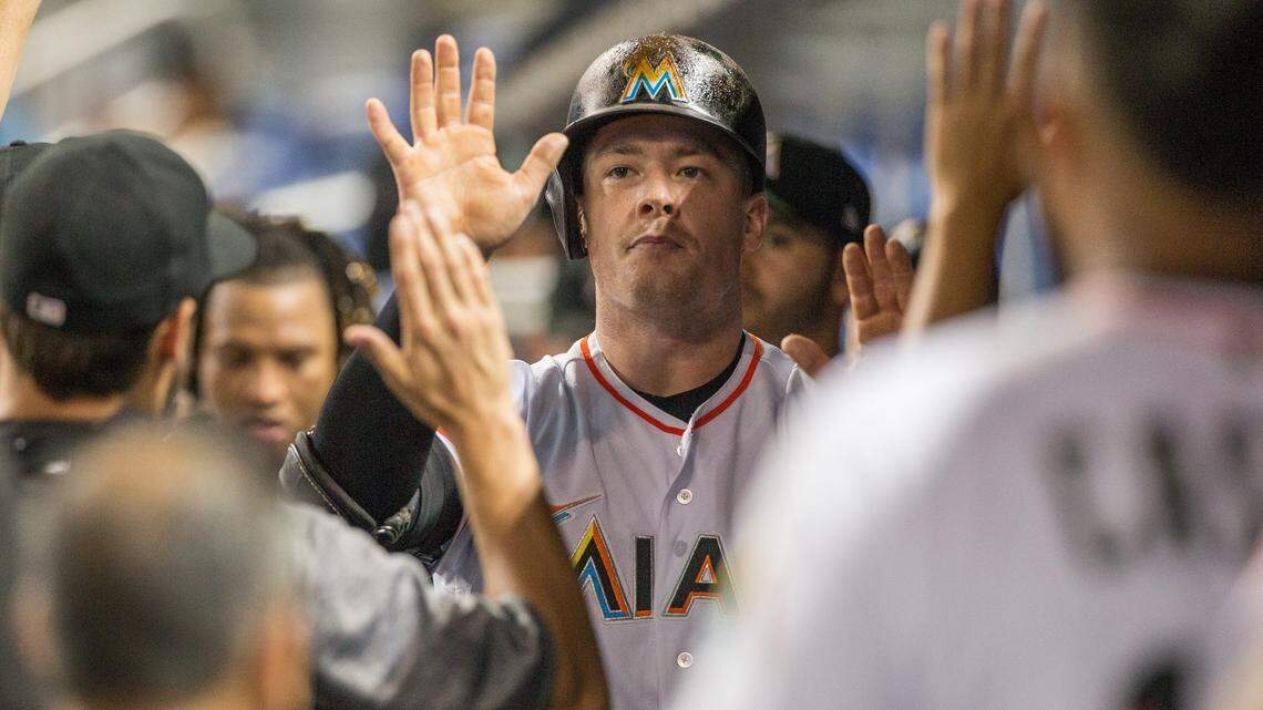 Miami Marlins first baseman Justin Bour (41) celebrates with teammates after his solo home run against the Atlanta Braves at Marlins Park in Miami, Monday, July 23, 2018.