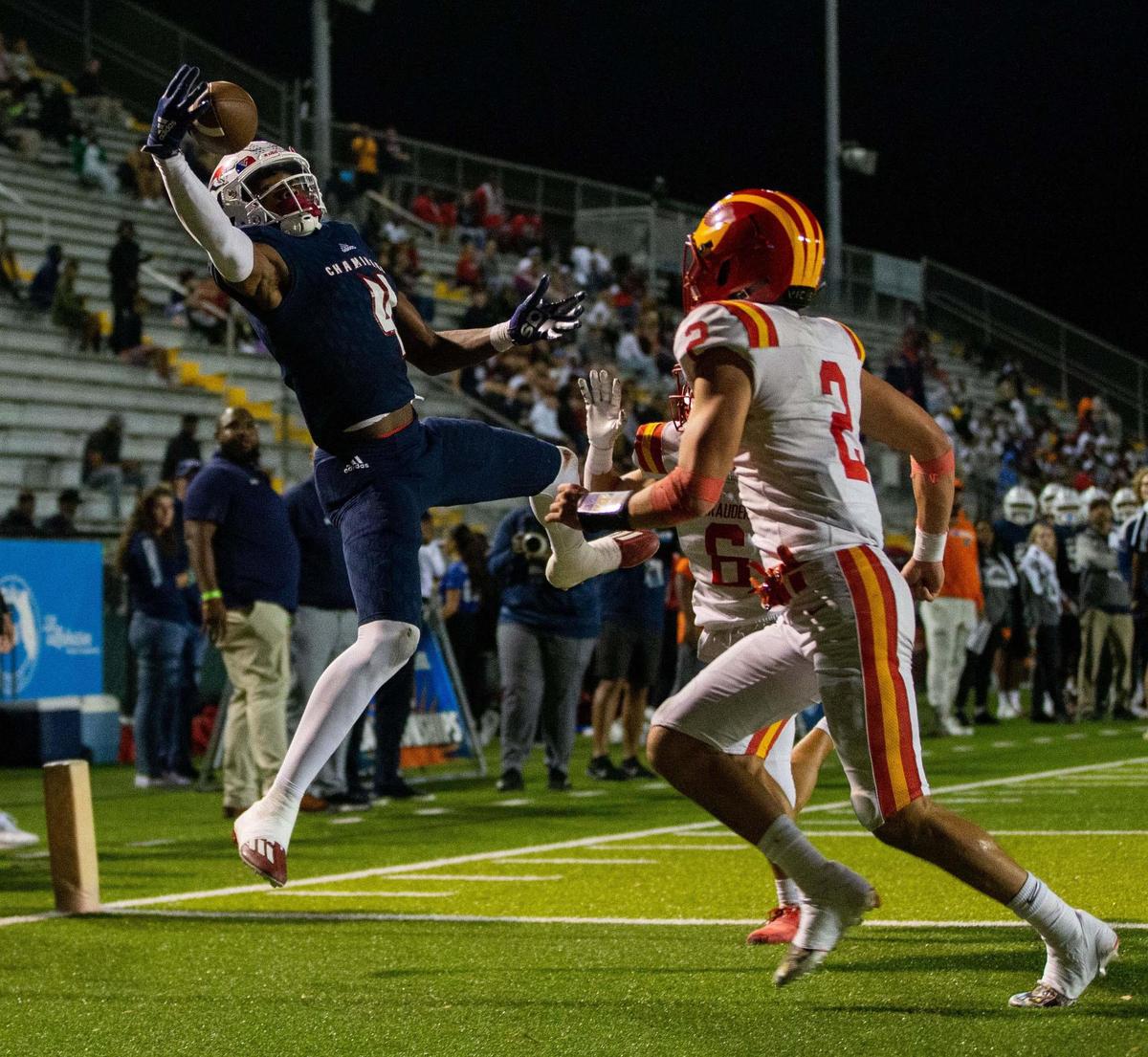 Chaminade wide receiver Jeremiah Smith (4) jumps and reaches out to catch a pass with one hand for a touchdown. The Chaminade Lions lead the Clearwater Central Catholic Marauders 28-0 at the half of the Class IM State Championship game at Gene Cox Stadium in Tallahassee, Florida on Thursday, Dec. 8, 2022.