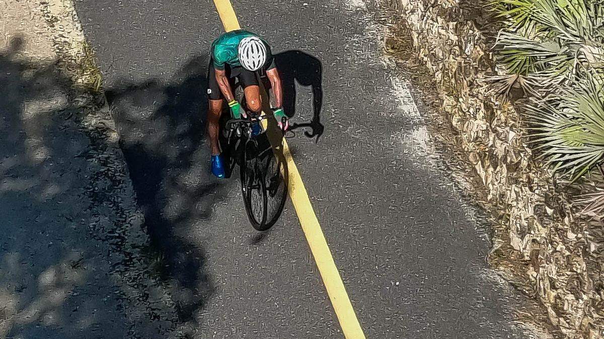 A bicyclist rides over I-75 on the Cross Florida Greenway Land Bridge in Marion County. The Florida Wildlife Corridor includes 17.7 million acres of land across Florida that residents are encouraged to explore and conserve.