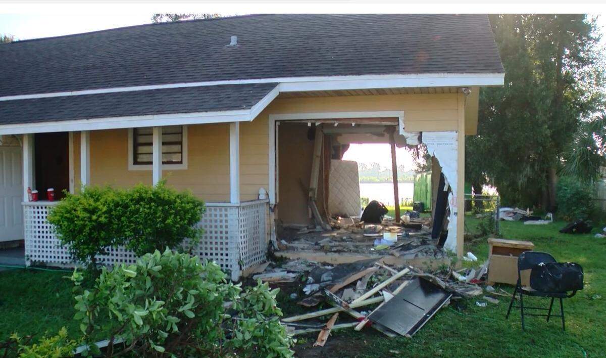 A Florida man was arrested Saturday morning after leaving a hole in a Lakeland home with his car, according to Polk County deputies/WFLA News Channel 8 screenshot