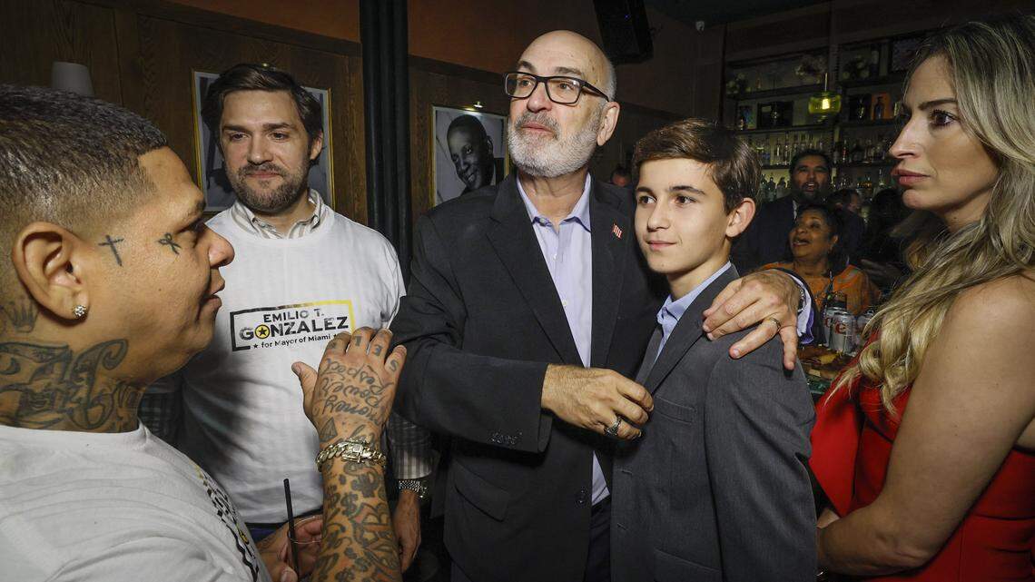 City of Miami mayoral candidate Emilio Gonzalez stands with his grandson Noah Guilarte, 13, as they watch early election results during election night watch party at Hoy Como Ayer in Little Havana, Miami Florida on Tuesday, November 4, 2025.