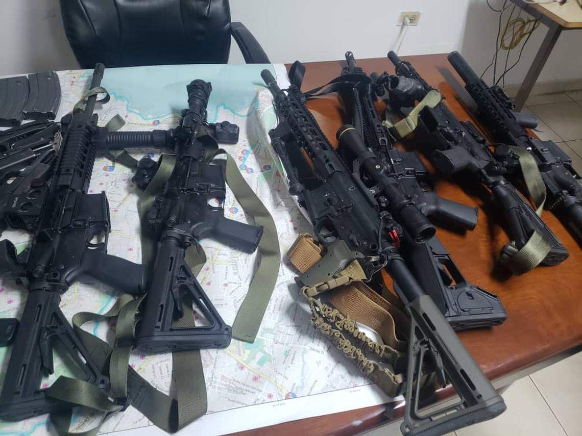 Some of the weapons found in cars driving around Port-au-Prince. Five Americans face weapons charges.