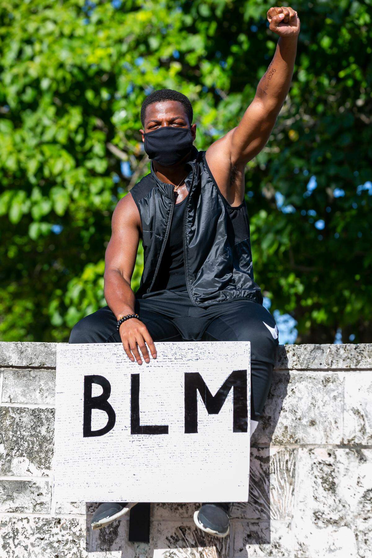 Shaquille Lazier participates in a Black Lives Matter protest in downtown Miami near Bayside on Saturday, August 29, 2020.