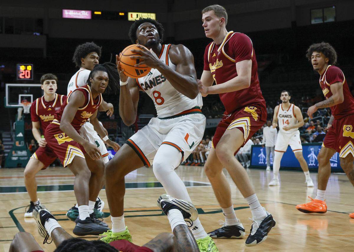 Miami Hurricanes center Ernest Udeh Jr. (8) looks to make a basket in the first half during their NCAA basketball game against the ULM Warhawks at Watsco Center, at the University of Miami campus in Coral Gables, Florida on Saturday, December 13, 2025.
