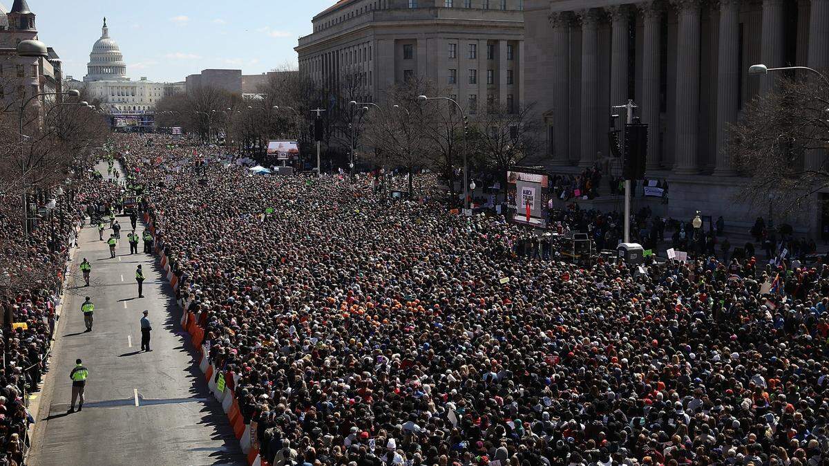 Gun reform advocates line Pennsylvania Avenue during the March for Our Lives rally March 24, 2018, in Washington, D.C. Hundreds of thousands of demonstrators gathered for the anti-gun-violence rally, spurred largely by the Valentine's Day shooting at Marjory Stoneman Douglas High School in Parkland, where 17 students and faculty members died.