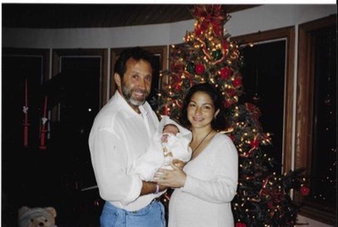 Emilio and Gloria Estefan in a family album photo with their daughter Emily Marie on her first Christmas in 1994. The photo is one of many from the Estefans’ family album to appear in the CD booklet for “Estefan Family Christmas.”