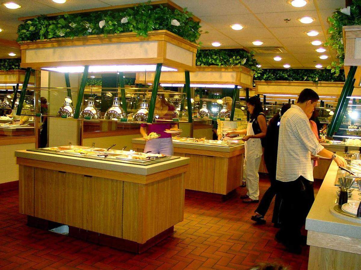 In 2001, patrons at the Hometown Buffet in Hallandale Beach visit the specially designed island buffets that prevent long lines and excessive waiting.