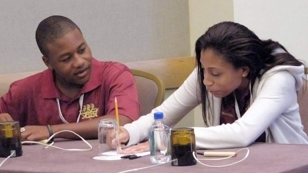 Representing Fort Lauderdale, David Reese and Gabriella Alvarez, both 17, consult over a question during the Senior preliminary rounds of The African American History Challenge in 2010. The Challenge is a Jeopardy and Trivial Pursuit-like academic contest held each year at the national conference of mentoring group 100 Black Men of America.