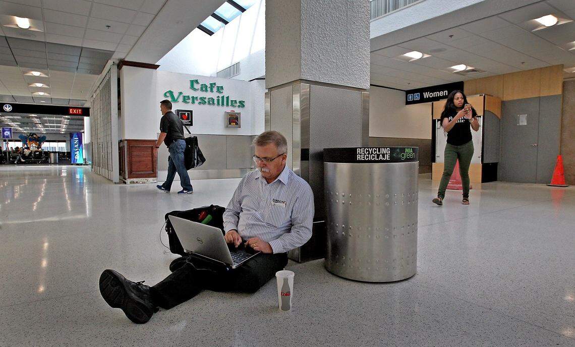 Chuck McCown of Salt Lake City, Utah, gets some work done in the renovated wing of Concourse E at Miami International Airport while waiting for a flight on March 27, 2017.