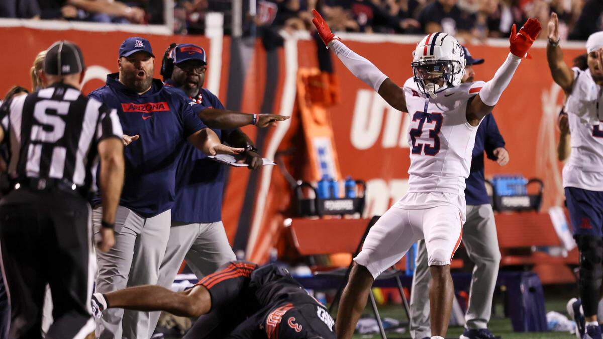 Sep 28, 2024; Salt Lake City, Utah, USA; Arizona Wildcats defensive back Emmanuel Karnley (23) reacts after breaking up a pass intended for Utah Utes wide receiver Dorian Singer (3) during the second quarter at Rice-Eccles Stadium.