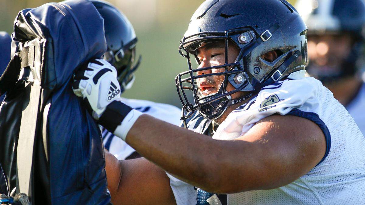FIU center Ming Tjon (69) works out during football practice at Florida International University in Miami, Florida, on Tuesday, August 16, 2022.