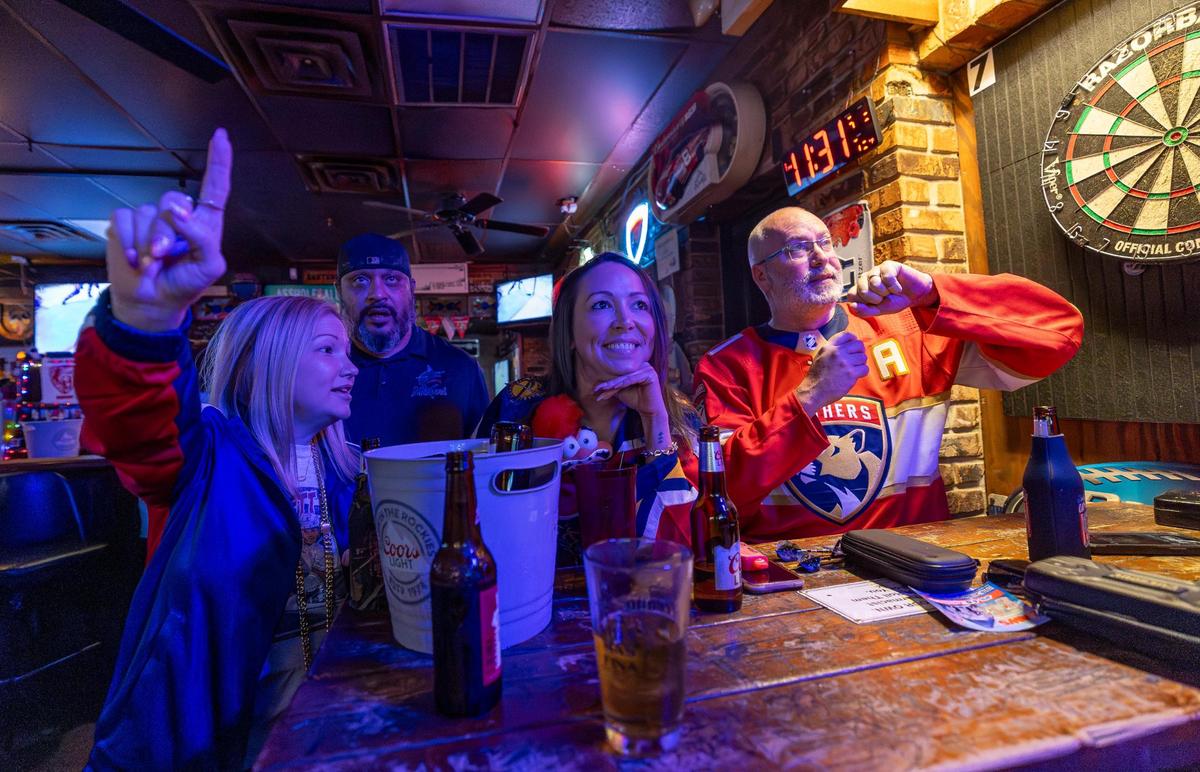 From left to right: Florida Panthers fans Kristen Knowles, Michelle Choquette, and Gary Knowles react as they watch their team play against the Edmonton Oilers in Game 2 of the NHL Stanley Cup Final at the Inn Field Bar & Grill on Friday, June 6, 2025, in Sunrise, Fla.