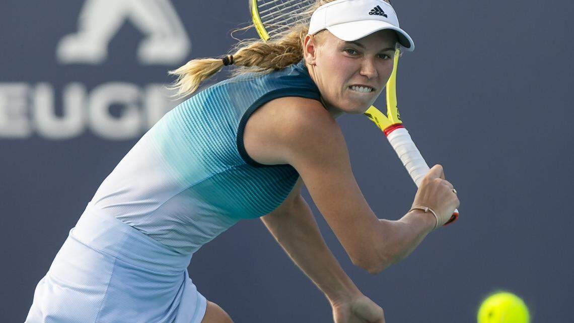 Caroline Wozniacki, of Denmark, returns a shot to Hsieh Su-wei, of Taiwan, during their match at the Miami Open tennis tournament on Monday, March 25, 2019 at Hard Rock Stadium in Miami Gardens.
