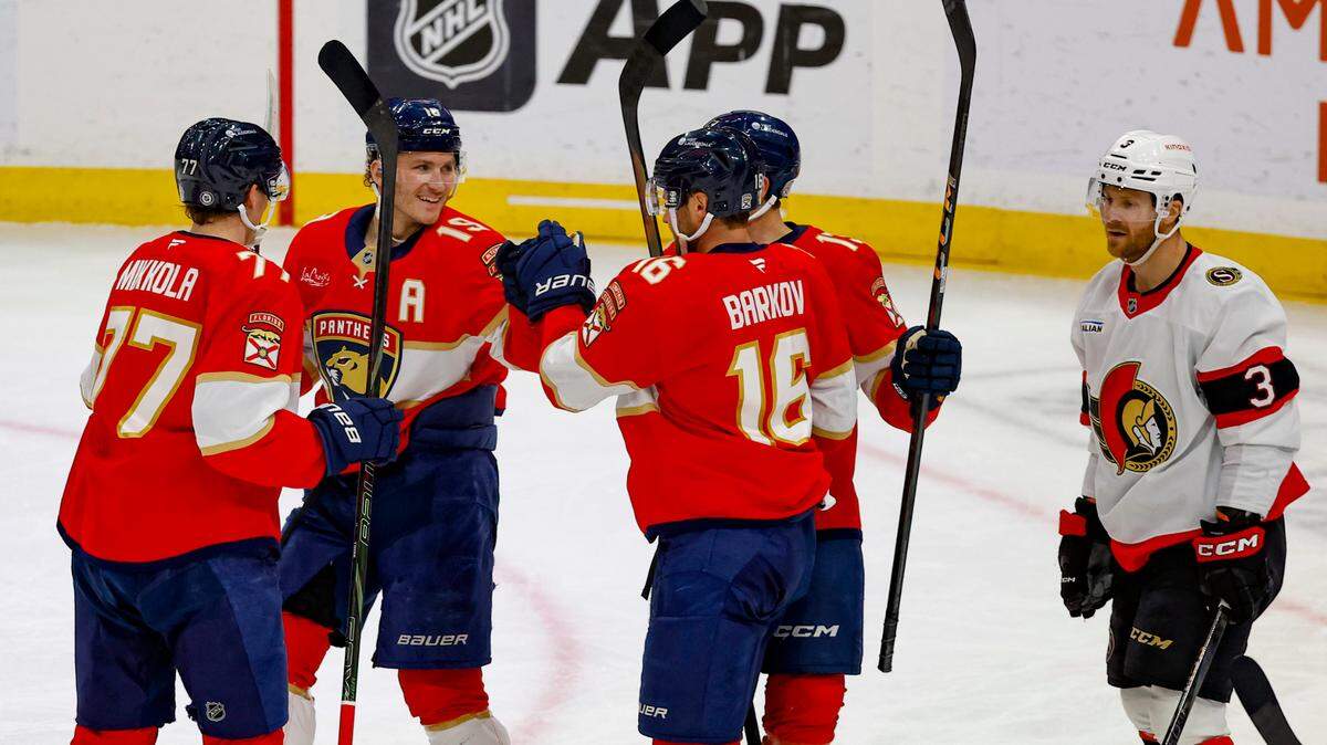 Florida Panthers left wing Matthew Tkachuk (19) and Florida Panthers center Aleksander Barkov (16) and teammates celebrate after scoring against the Ottawa Senators in the second period during their NHL Hockey match at Amerant Bank Arena in Sunrise, Florida on Saturday, February 8, 2025.