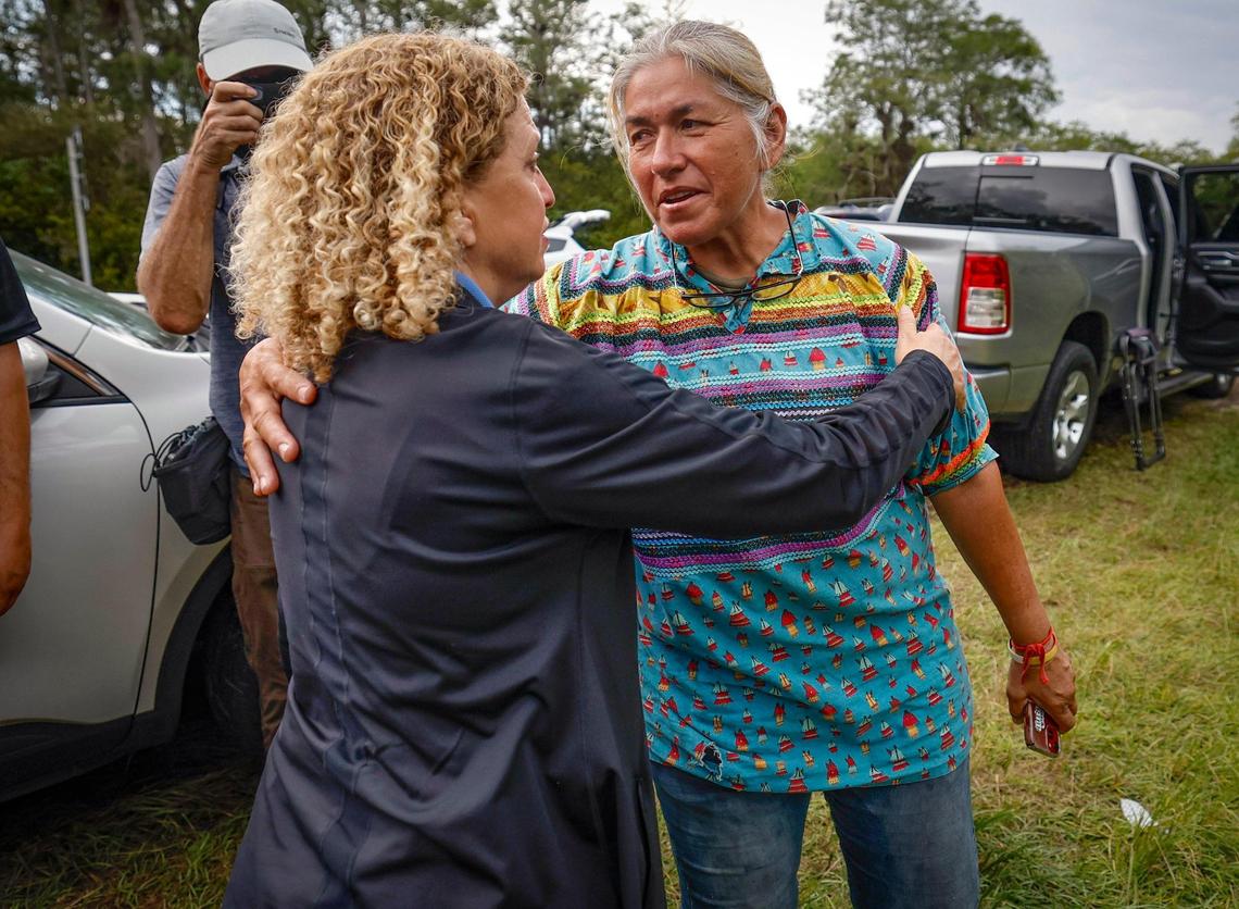 U.S. Representative Debbie Wasserman Schultz is greeted by Miccosukee tribe member Betty Osceola after touring Alligator Alcatraz. The facility is located within the Florida Everglades, 36 miles west of the central business district of Miami, in Collier County, Florida Saturday, July 12, 2025.