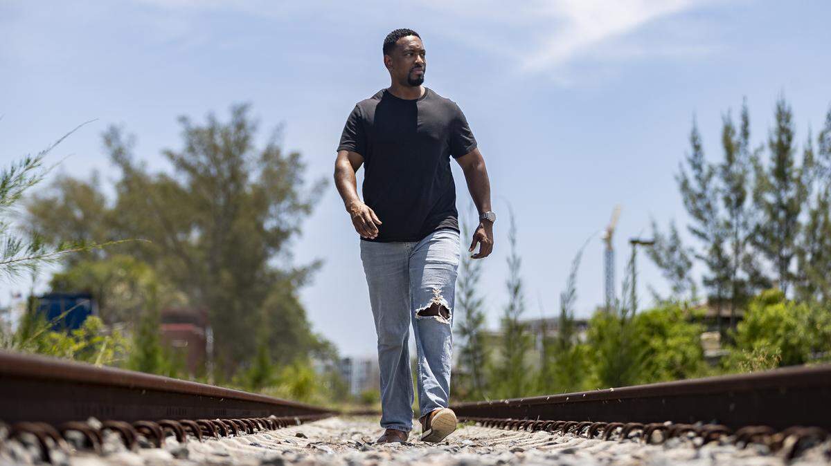 Darren Brown, a former Brightline train conductor, visits train tracks near the Northwood Art and Music Warehouse on Thursday, July 31, 2025, in West Palm Beach, Fla.