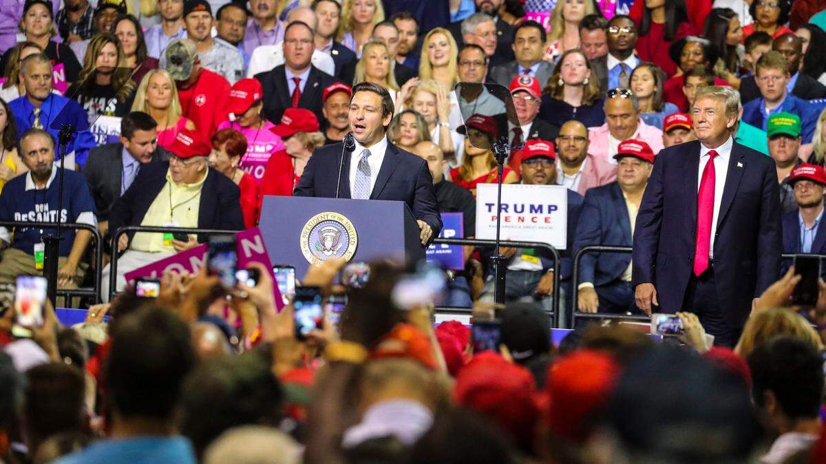 Ron DeSantis speaks at a 2018, rally in Tampa for then-President Donald Trump, right. That year, Trump had endorsed DeSantis for Florida governor.