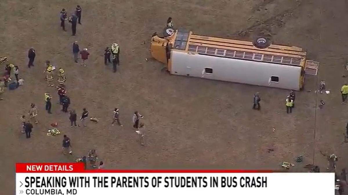 Four middle school students were injured when their school bus ran off the road and landed on its side in Howard County, Maryland.