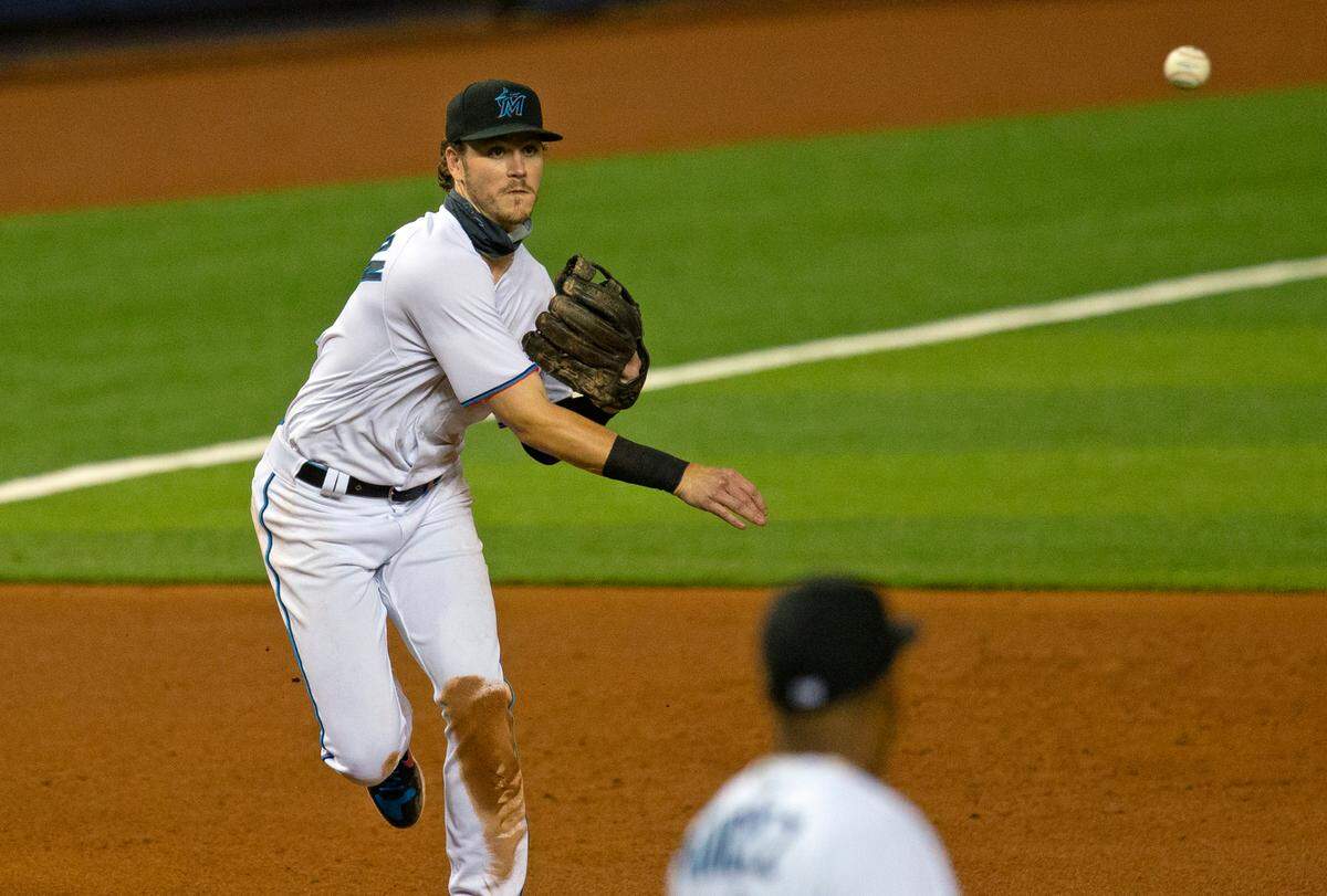 Miami Marlins third baseman Brian Anderson (15) throws to first during the fifth inning of a baseball game against the Toronto Blue Jays at Marlins Park in Miami on Wednesday, September 2, 2020.