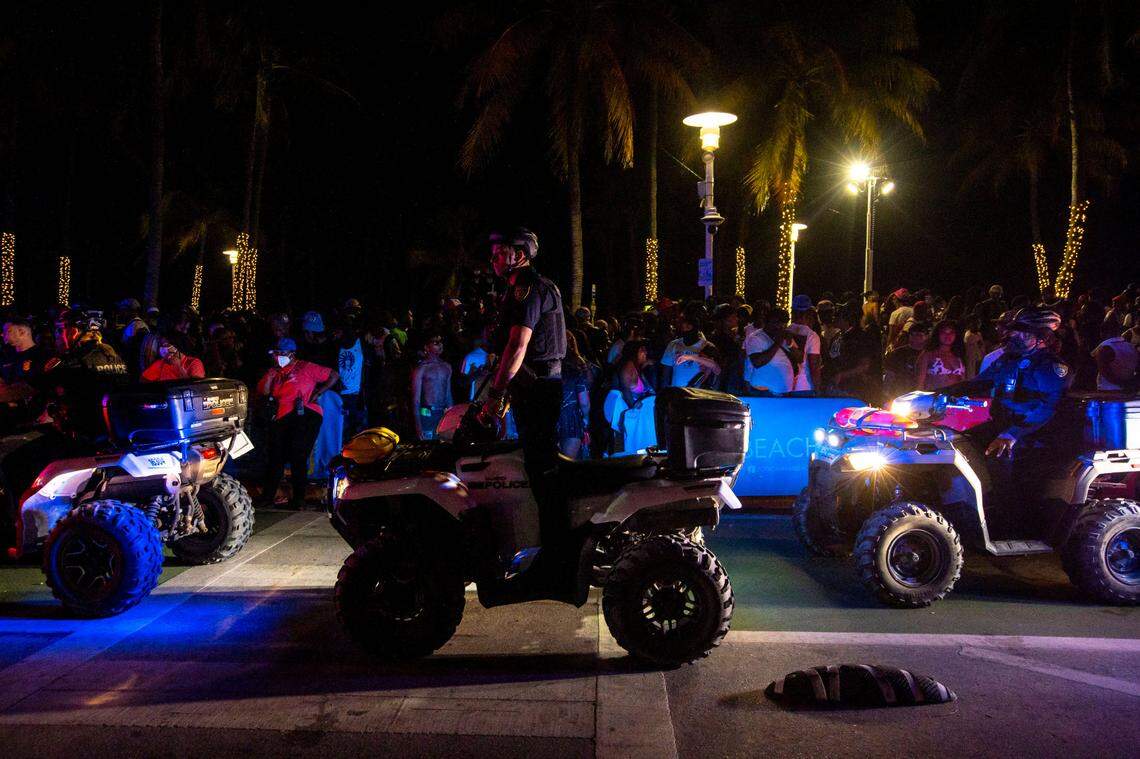 Miami Beach Police officers patrol on all-terrain vehicles up and down Ocean Drive during Spring Break in Miami Beach, Florida, on Saturday, March 19, 2022.
