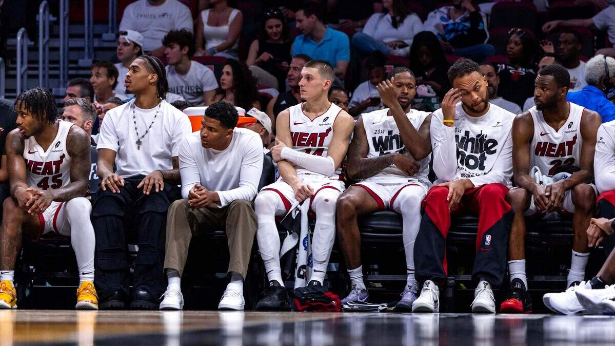 Miami Heat players react on the team bench while down to the Cleveland Cavaliers during the second half of Game 3 of the NBA Playoffs at Kaseya Center on April 26, 2025, in Miami.