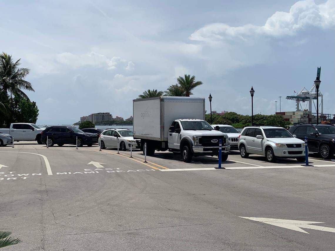Vehicles wait for the Fisher Island ferry on Sunday morning after a boat crashed into the ferry early Sunday morning, which caused the closure of PortMiami.