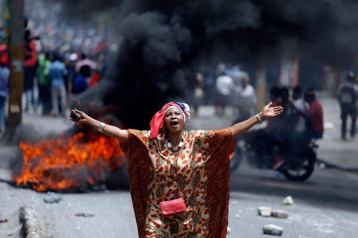 A protester yells anti-government slogans in Port-au-Prince, Haiti, Sunday, June 9, 2019. Protesters denouncing corruption paralyzed much of the capital as they demanded the removal of President Jovenel Moise. (AP Photo/Dieu Nalio Chery)