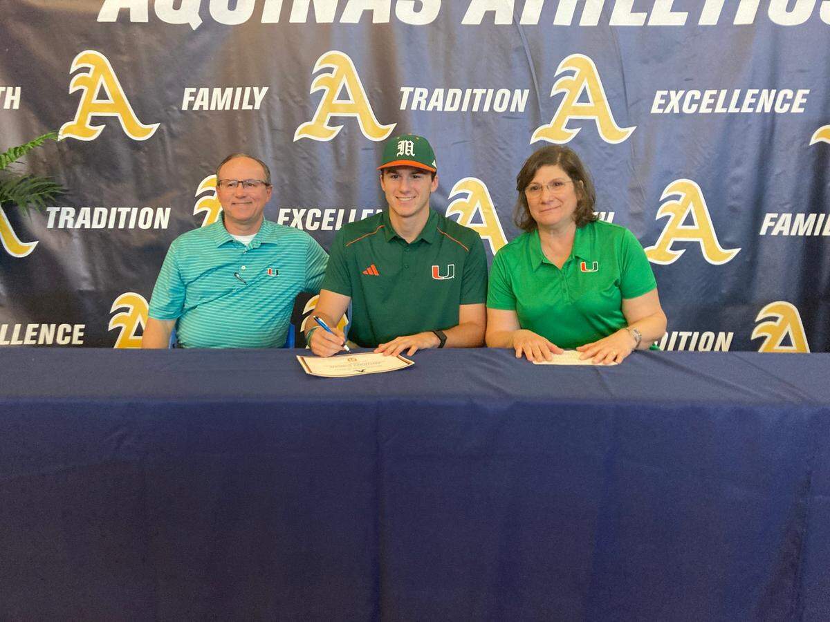 St. Thomas Aquinas pitcher Anthony Ciscar (middle), flanked by his father, Mike (left), and mother, Amanda, (right) signed with the University of Miami during at ceremony at Aquinas on Wednesday afternoon.