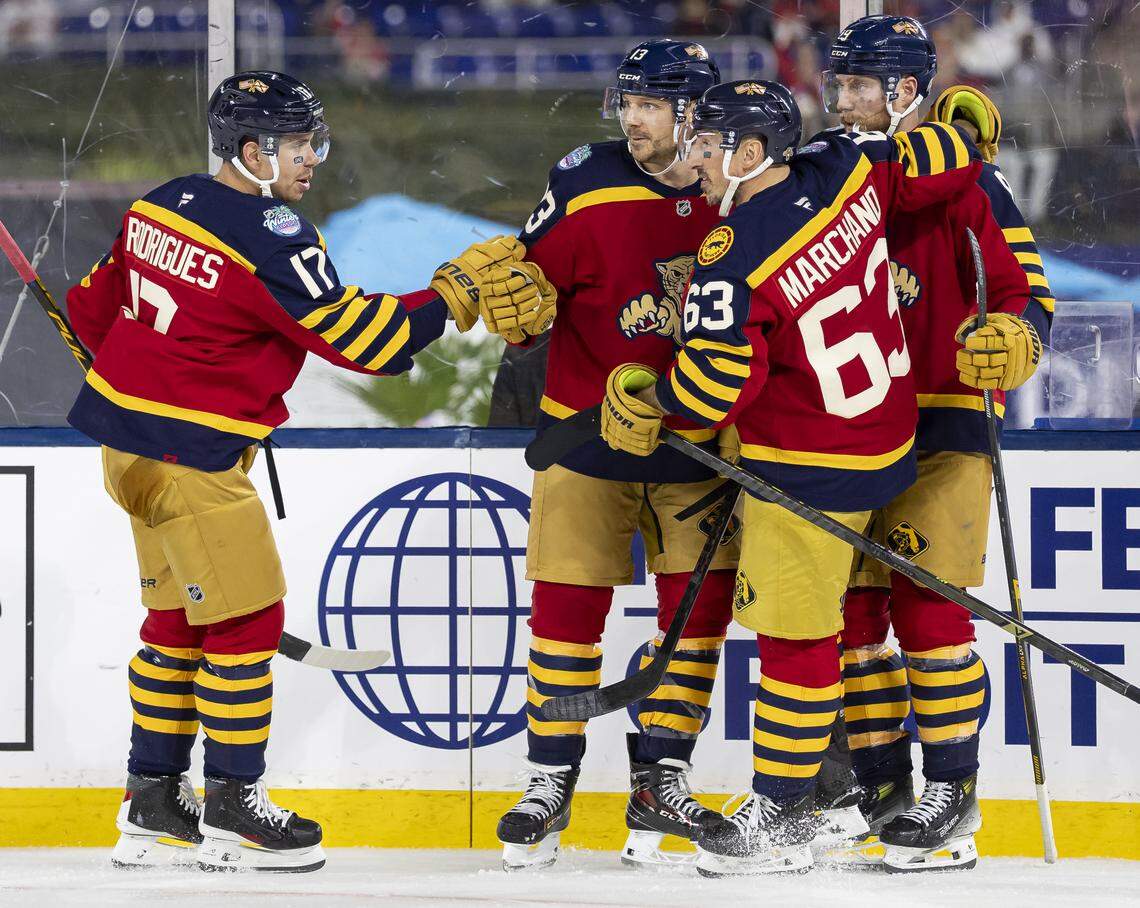 Florida Panthers center Sam Reinhart (13) celebrates with his teammates after scoring against the New York Rangers in the third period of their Winter Classic outdoor hockey game at loanDepot park on Friday, Jan. 2, 2026, in Miami, Fla.