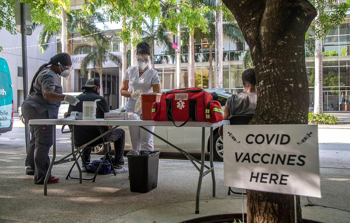 Medical staff vaccinate the homeless population living in downtown Miami at a post set up on Flagler Street with the (J&J/Janssen) COVID-19 vaccine. The Miami-Dade County Homeless Trust and the Florida Division of Emergency Management conducted vaccination tours to give the homeless easy access to the vaccine, on May 25, 2021.