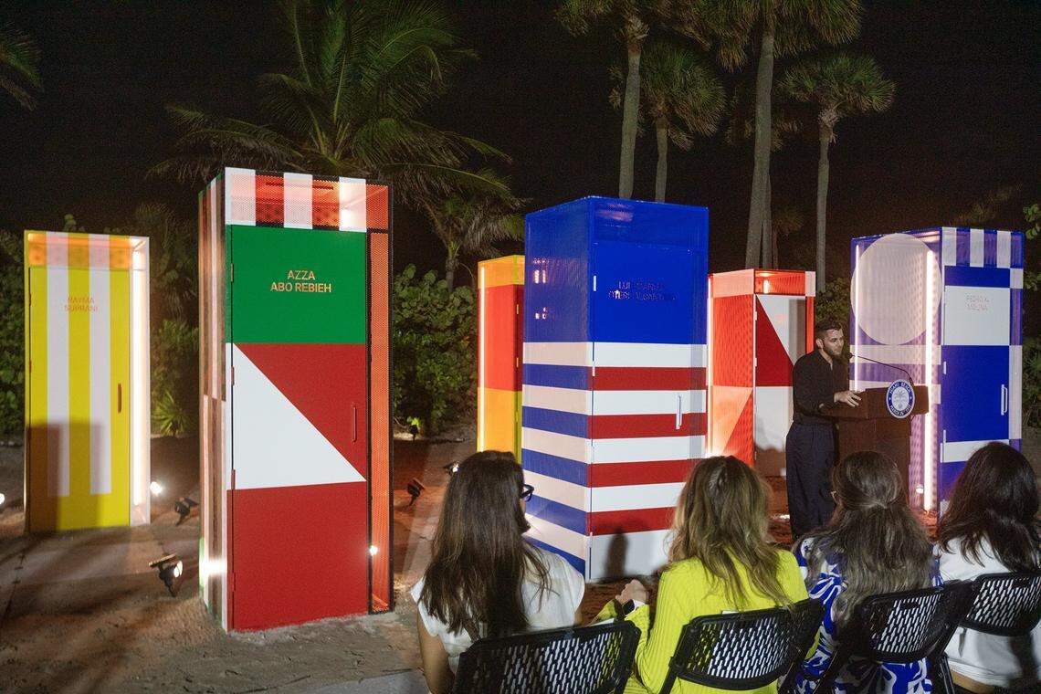 Miami Beach, Florida, December 1, 2025 - Miami Beach Alian Collazo, Executive Director of Cuban Freedom March, right, speaks to guests during the unveiling of an installation titled Doors to Freedom. Doors to Freedom is public art installation that tells the stories of artists exposing authoritarian regimes. The installation will run from Dec. 1-7, 2025, at Art Week Miami Beach, during this year's Art Basel. Every artist featured in Doors to Freedom has been harassed, jailed, or exiled for refusing to remain silent. They are, The Gao Brothers (China), Luis Manuel Otero Alcántara (Cuba), Rayma Suprani (Venezuela), Song Byeok (Korea), Azza Abo Rebieh (Syria), Pedro X. Molina (Nicaragua), Zehra Dogan (Turkey) The installation was produced by the Human Rights Foundation (HRF), Cuban Freedom March (CFM), and sponsored by the City of Miami Beach. Executive Director Cuaban Freedom, Alian Collazo talks about the “Doors to Freedom,” a new Art Week installation unveiled by The Human Rights Foundation, Cuban Freedom March, and the City of Miami Beach, who artists challenge authoritarian regimes, during Art Week 2025, Miami Beach on December 1st., 2025.