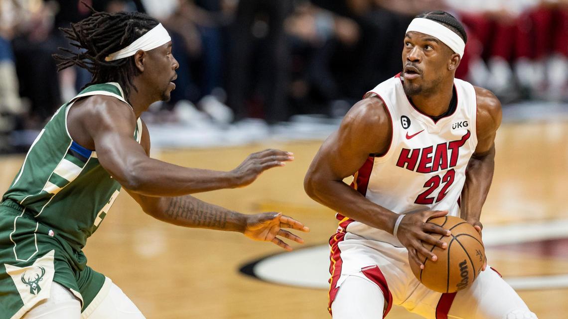 Miami Heat forward Jimmy Butler (22) looks to take a shot while Milwaukee Bucks guard Jrue Holiday (21) defends during the first quarter of Game 4 in the first-round NBA playoff series at Kaseya Center on Monday, April 24, 2023, in downtown Miami.