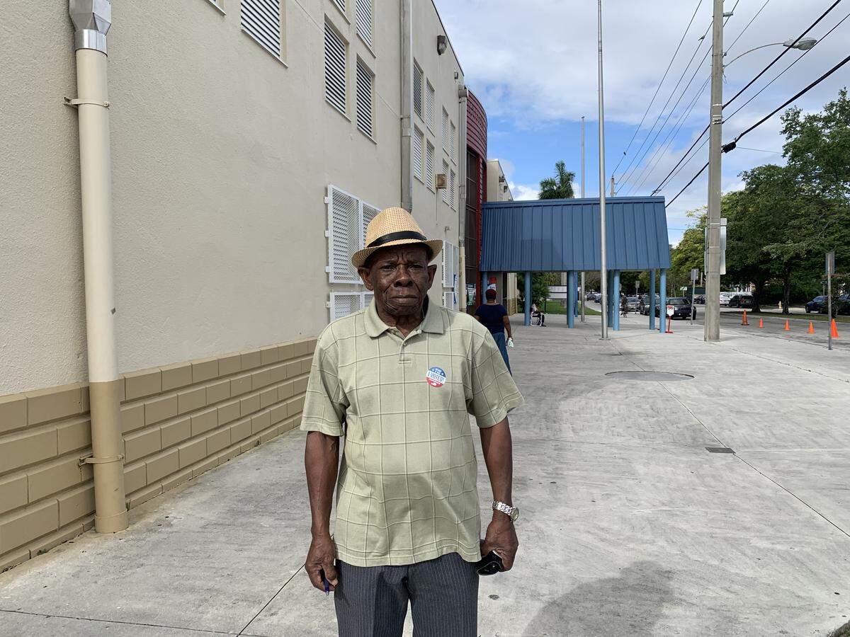 Joseph Petithomme, 85, came ready to vote in the Democratic primary election Tuesday at Toussaint L’Ouverture Elementary School in Little Haiti.