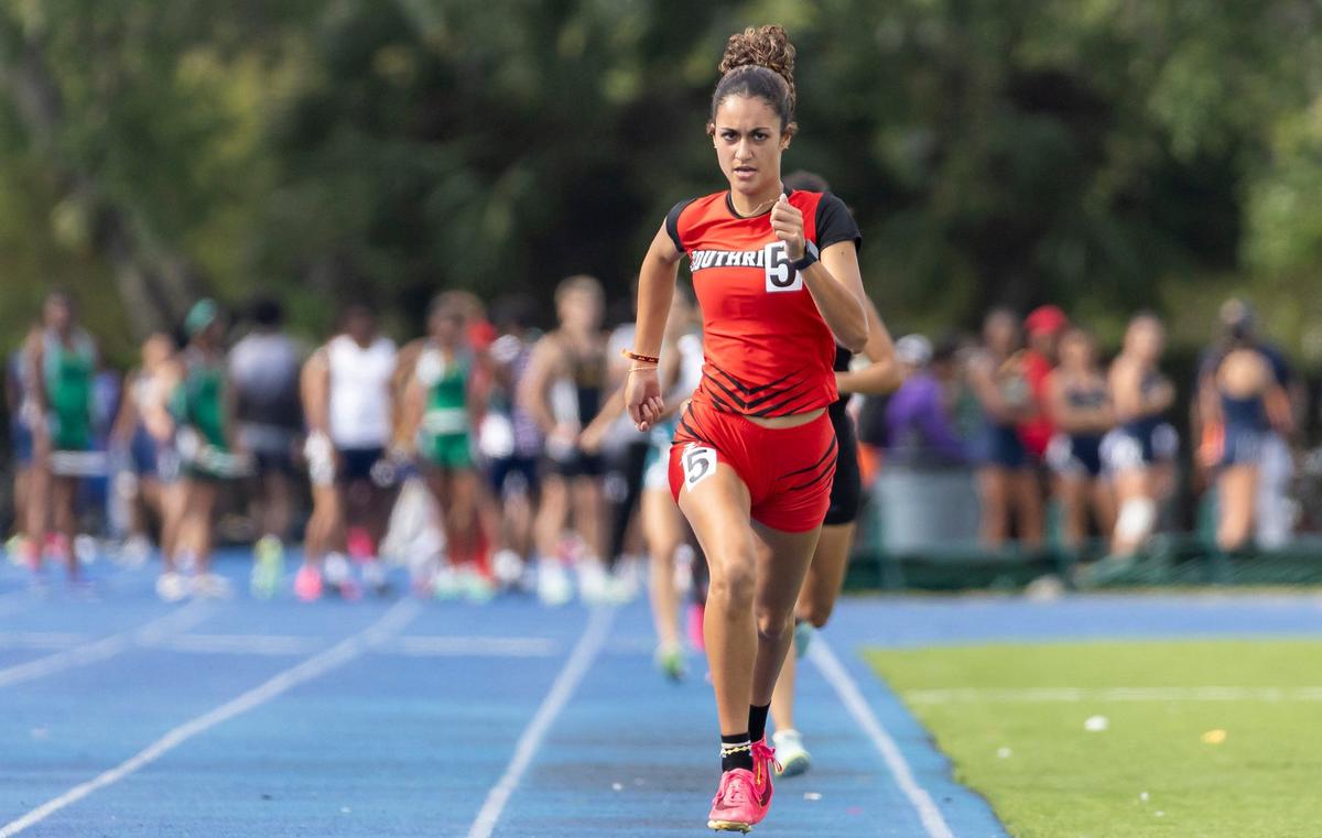 Nicole Dragoni, from Miami Southridge Senior High School, competes in the girls 1600 meter run during the GMAC track and field championships at the Traz Powell Stadium on Thursday, April 11, 2024, in Miami, Fla.