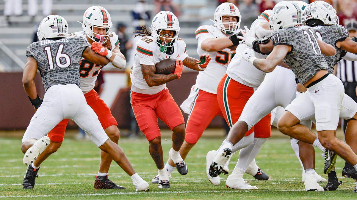 Miami Hurricanes running back Girard Pringle Jr. (22) on a carry in the first half against the Virginia Tech Hokies at Lane Stadium in Blacksburg, Virginia, on Saturday, November 22, 2025.