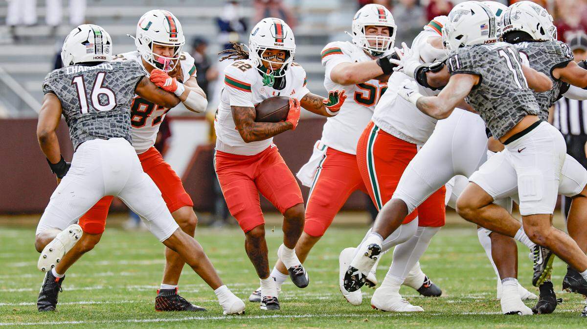 Miami Hurricanes running back Girard Pringle Jr. (22) on a carry in the first half against the Virginia Tech Hokies at Lane Stadium in Blacksburg, Virginia, on Saturday, November 22, 2025.