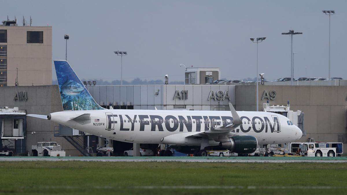 A Frontier Airlines plane (not this one) was the site of an incident Friday, May 18, 2018, at the Orlando International Airport. A man is accused of punching a deaf and pregnant woman and her service dog after the plane landed.
