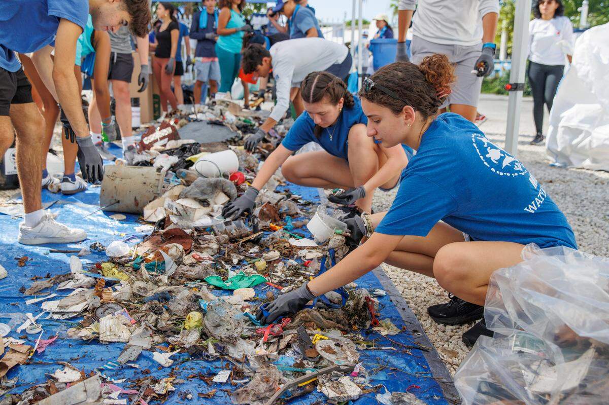 At the 2024 International Coastal Clean-Up, volunteers with Miami Waterkeeper sort through waste and marine debris dumped in Biscayne Bay.