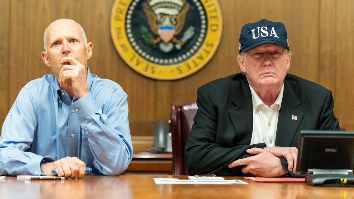 President Donald Trump, joined by U.S. Senator Rick Scott, R-Fla., receives a Federal Emergency Management Agency briefing on Hurricane Dorian as it approaches the U.S. mainland Saturday, Aug. 31, 2019, at Camp David near Thurmont, Md.