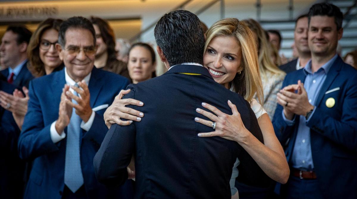 Simi Valley, CA - June 15, 2023 - Gloria Suarez hugs her husband, Miami Mayor Francis Suarez, after the speech he delivered as a candidate for the 2024 Republican presidential nomination at the Ronald Reagan Presidential Library in Simi Valley, California