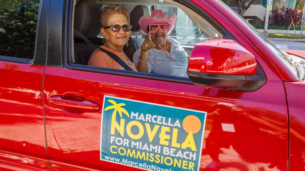 Campaign worker Liliana Martinez (right) drives Miami Beach resident Angela Acosta back home after she voted at the early voting site at Miami Beach City Hall on Tuesday, Oct. 31, 2023.
