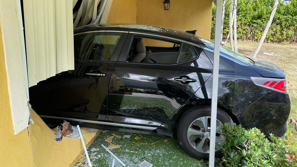 After a car drove into a Miami-Dade County home, a child and the driver were sent to the hospital. The driver was initially trapped inside the car.