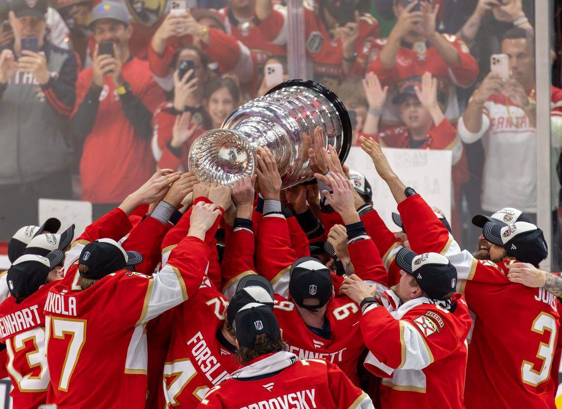 The Florida Panthers celebrate with the Stanley Cup after defeating the Edmonton Oilers 5-1 in Game 6 of the Final at Amerant Bank Arena in Sunrise, Fla., on Tuesday, June 17, 2025, clinching the NHL championship.