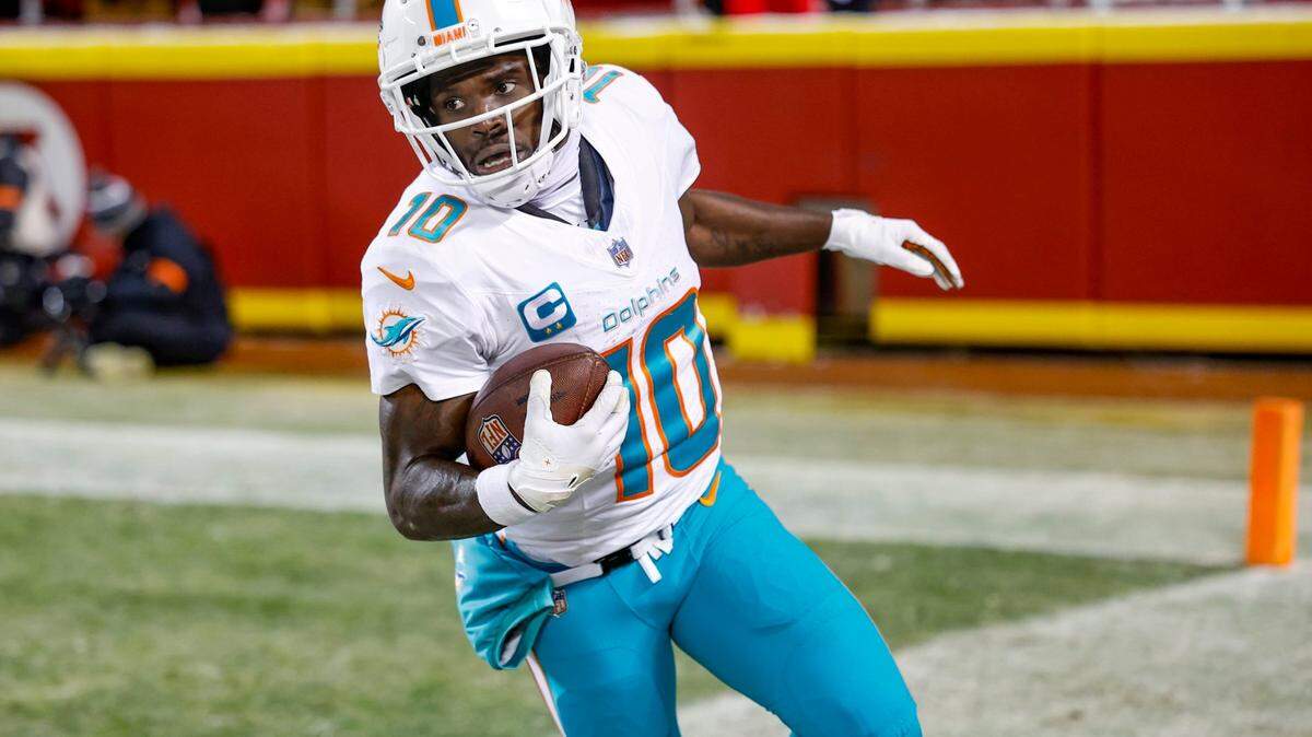 Miami Dolphins wide receiver Tyreek Hill (10) scores in the second quarter against the Kansas City Chiefs at GEHA Field at Arrowhead Stadium in Kansas City, Missouri, on Saturday, January 13, 2024.
