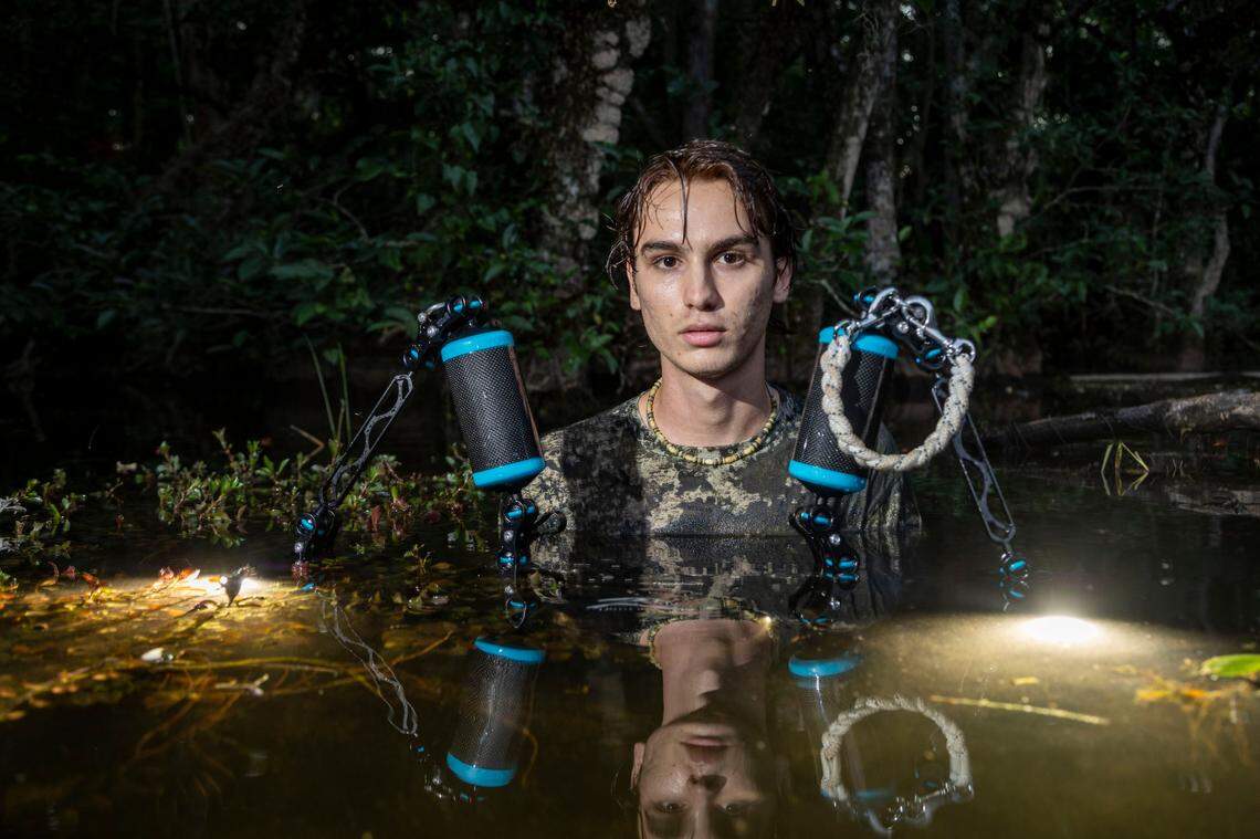 Miami, Florida, April 17, 2024 - Luca Martinez with his camera gear off road near Gator Hook Trail in Big Cypress National Preserve.