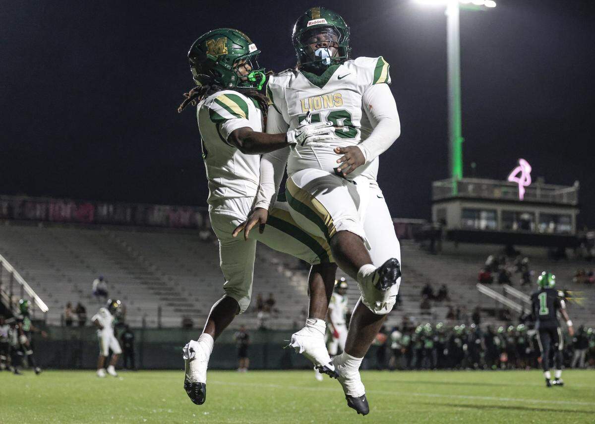 Mater Academy's running back Jean-Baptiste Rahdel (10) celebrates in the endzone with offensive lineman Jaidan Thomas (59) after scoring in the first half against North Miami High School during their high school football game at Milander Stadium in Hialeah, Florida, on Saturday, September 27, 2025.
